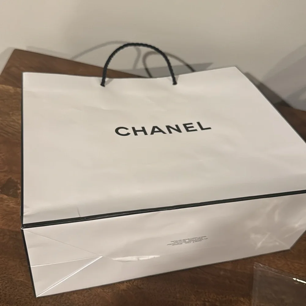 Authentic CHANEL gift bag. 10.5 x 9 x 4.5 in. White with logo in black